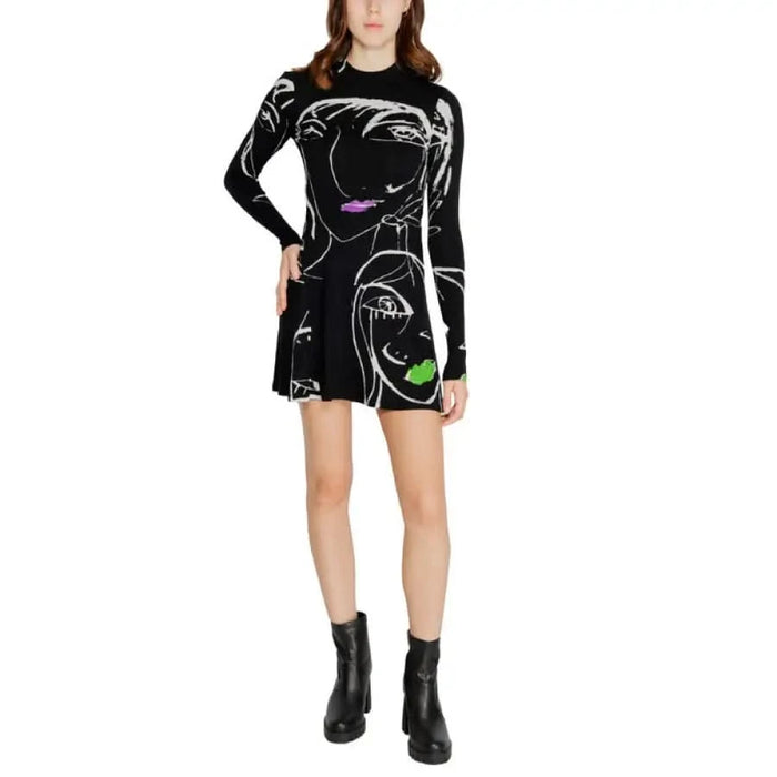 Black long-sleeved mini dress with abstract white line art and colorful accents by Desigual