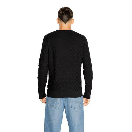 Black long-sleeved sweater from the back for Calvin Klein Men Knitwear collection