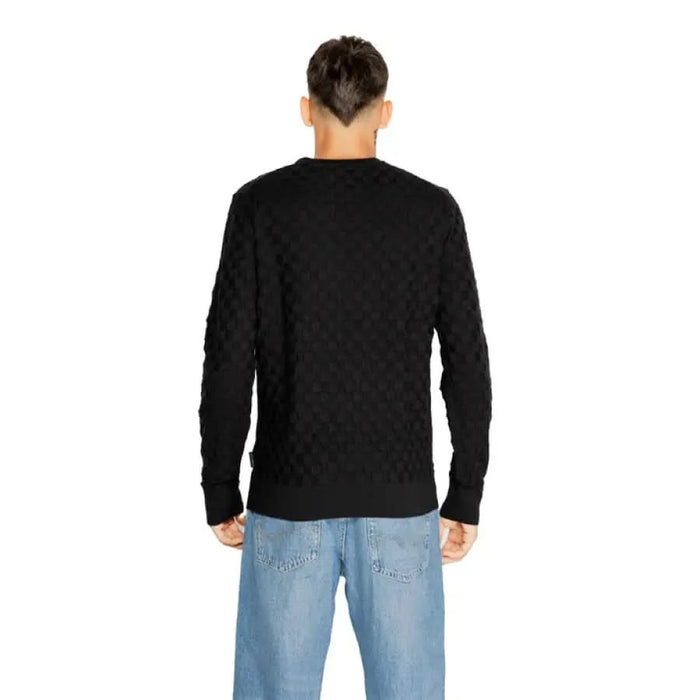 Black long-sleeved sweater from the back for Calvin Klein Men Knitwear collection