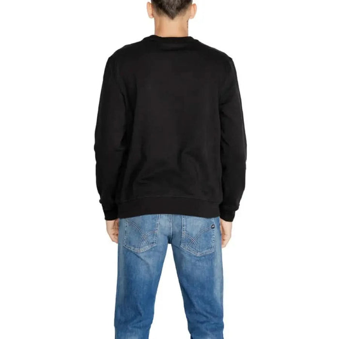 Antony Morato black long-sleeved sweatshirt worn with blue jeans, back view