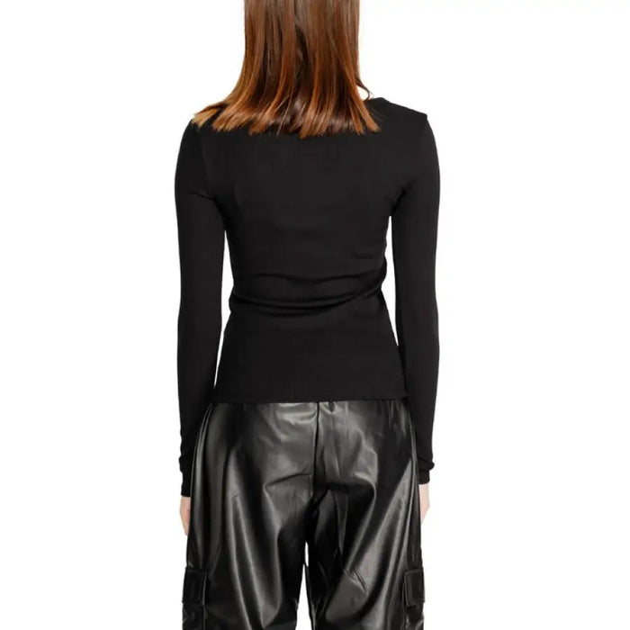 Black long-sleeved Guess Active Women T-Shirt viewed from behind on a person with brown hair