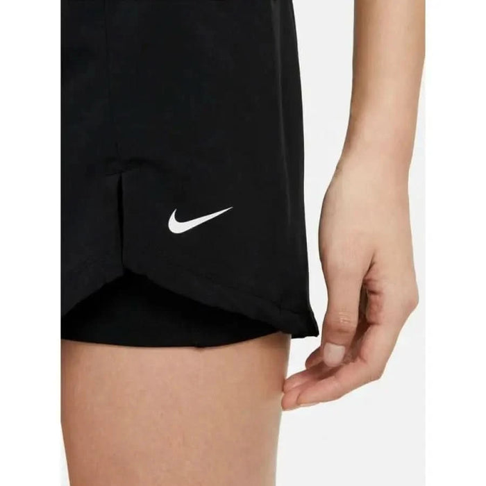 Black Nike athletic shorts featuring a white Swoosh logo for women