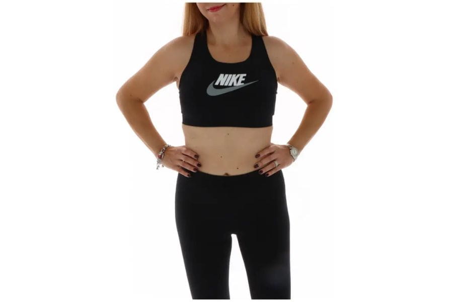 Black Nike sports bra worn as part of a stylish holiday outfit for active apparel.