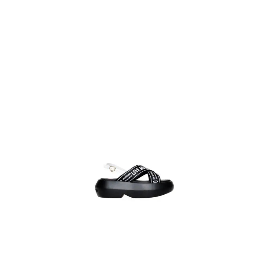 Black Love Moschino platform sandal with crisscross straps and branding