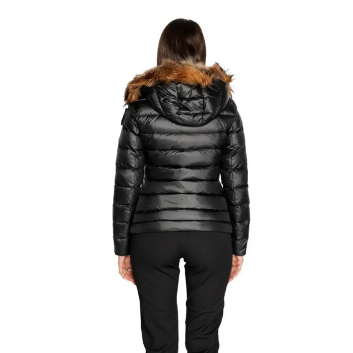 Black puffer jacket with fur-trimmed hood displayed from the back by Blauer