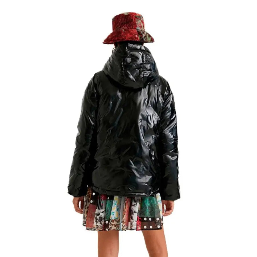 Desigual Women’s Black Puffy Winter Jacket with Red Patterned Hat on Display
