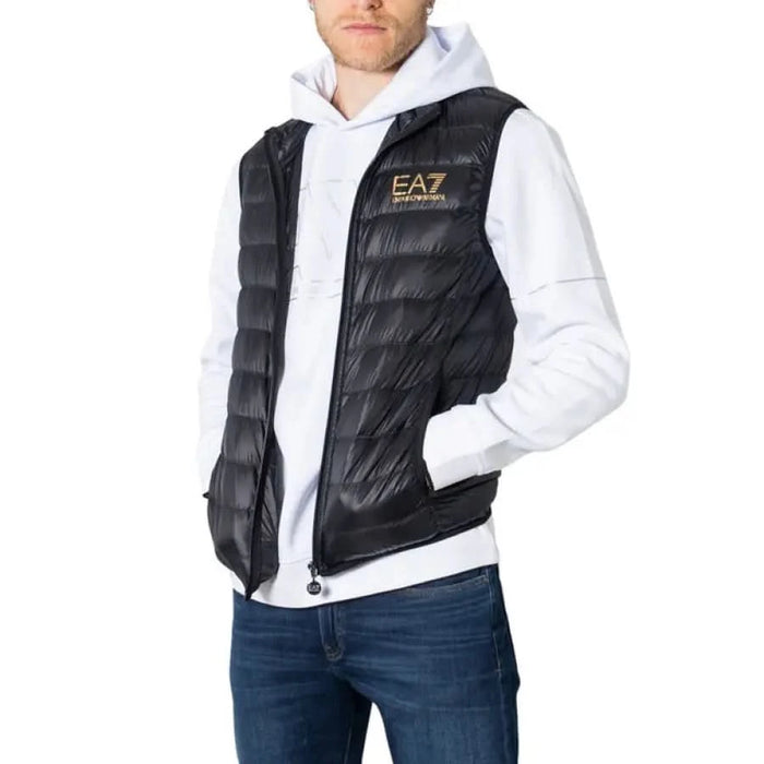 Black quilted puffer vest with EA7 logo worn over a white hoodie in Ea7 Men Gilet