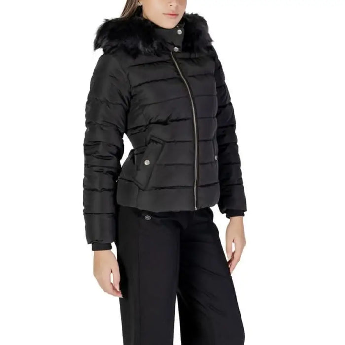 Black quilted puffer jacket with faux fur hood and asymmetrical zipper by Only