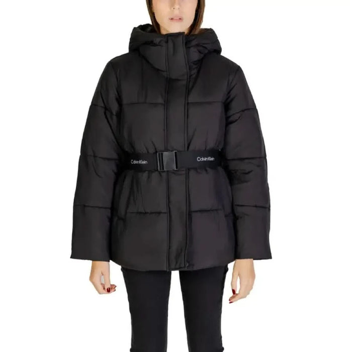 Black quilted Calvin Klein women’s puffer jacket with hood and belt for winter wear