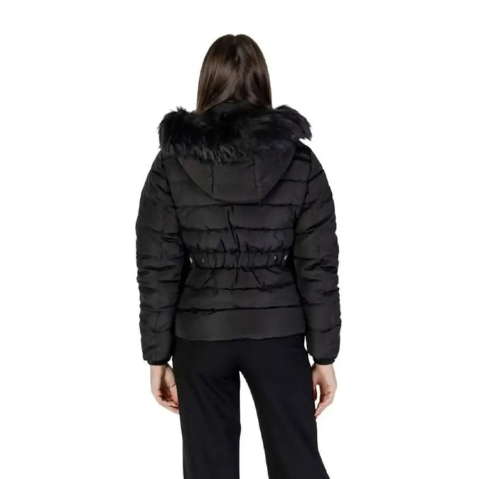 Black quilted winter jacket by Only featuring a fur-trimmed hood and cinched waist