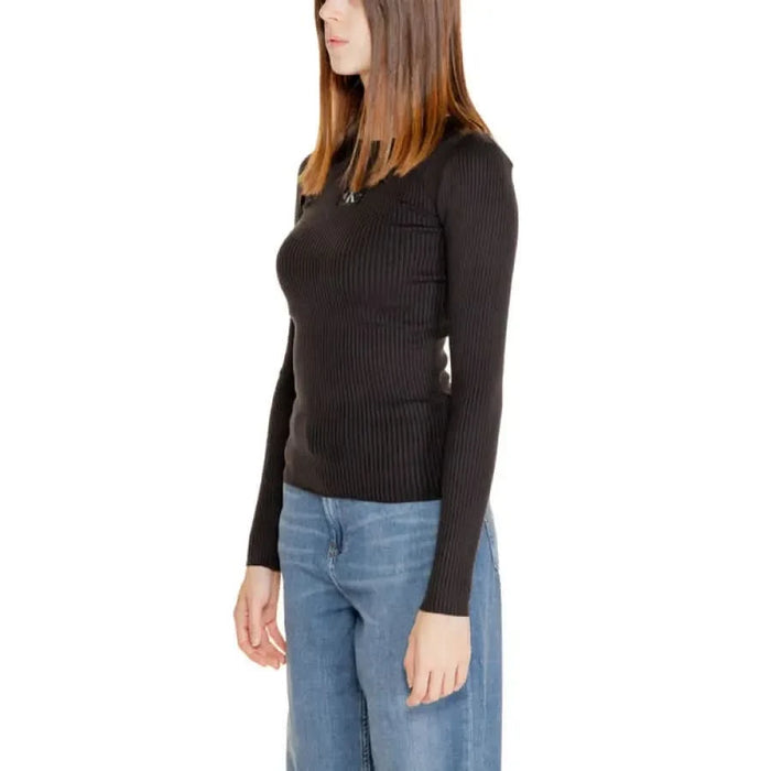 Woman in black ribbed long-sleeve sweater and blue jeans - Calvin Klein Jeans Women Knitwear