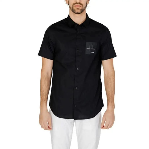 Black short-sleeved button-up shirt with chest pocket by Armani Exchange Men