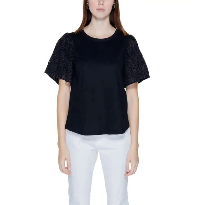 Jacqueline De Yong black short-sleeved top with textured sleeves over white pants