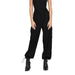 Black sleeveless cargo jumpsuit with drawstring ankle cuffs and stylish boots