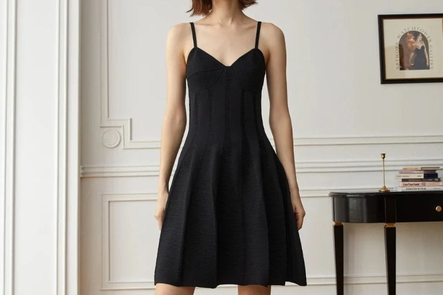 Black sleeveless dress featuring a fitted bodice and flared skirt ideal for a first date.