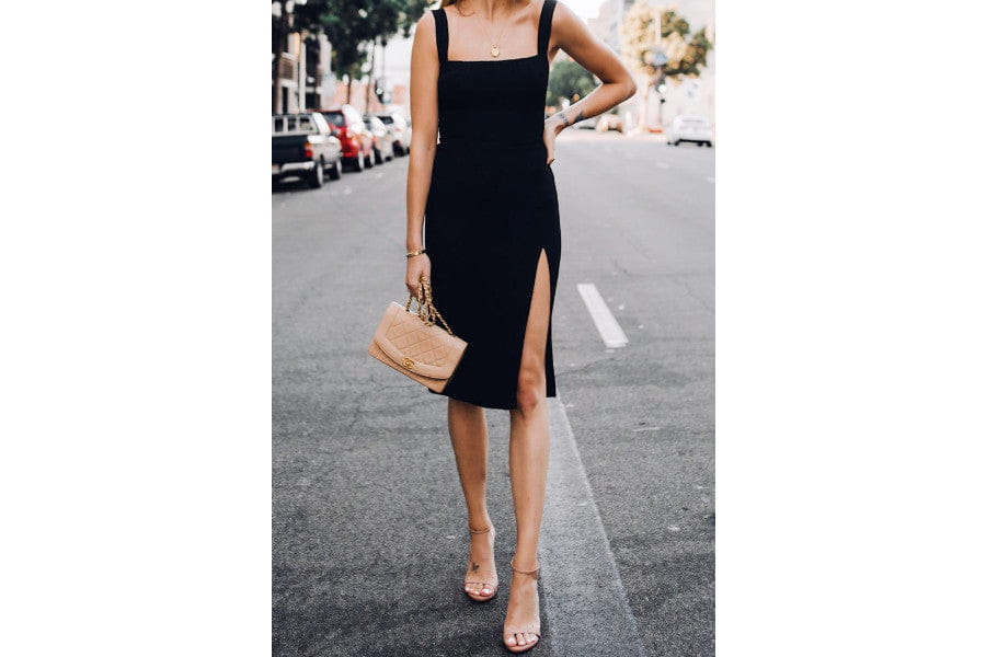 Black sleeveless midi dress with side slit for stylish minimalist outfits to shop.