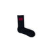 Black sock with red ’HUGO’ logo patch on the ankle from Hugo - Hugo Men Underwear collection