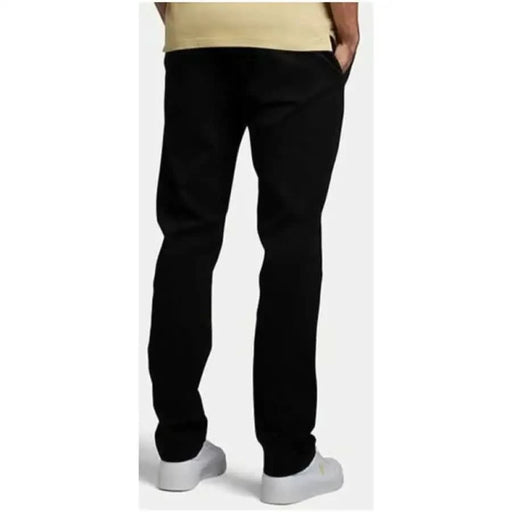 Black straight-leg trousers worn by a person from Lyle & Scott Men Trousers collection