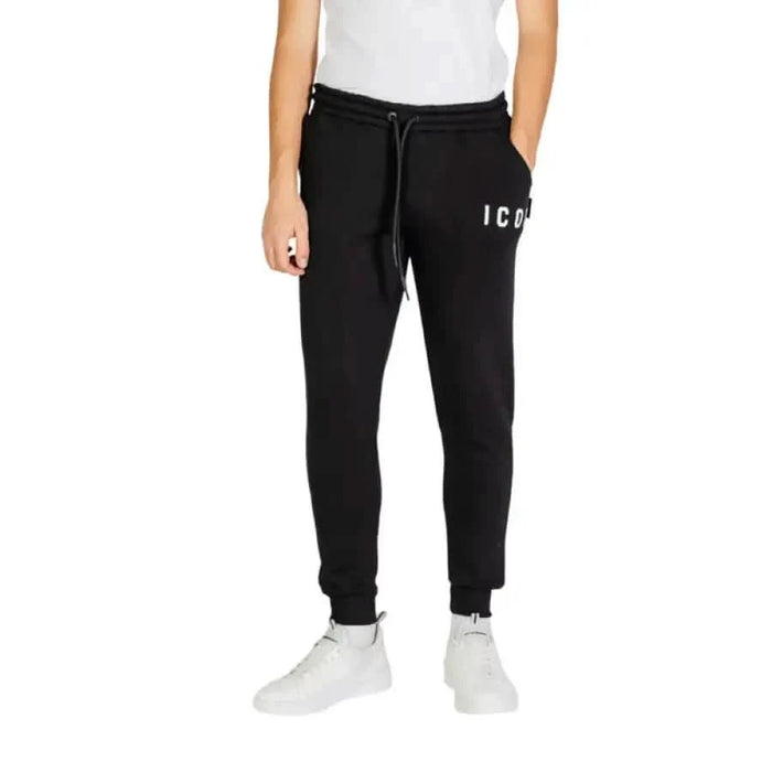 Black sweatpants featuring ICON text on the leg from Icon Men Trousers for Fall Winter