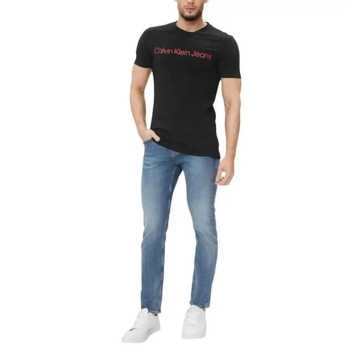 Black Calvin Klein Jeans T-shirt featuring red logo text on the chest for men