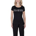 Black Guess Women T-Shirt featuring sparkly logo text across the chest