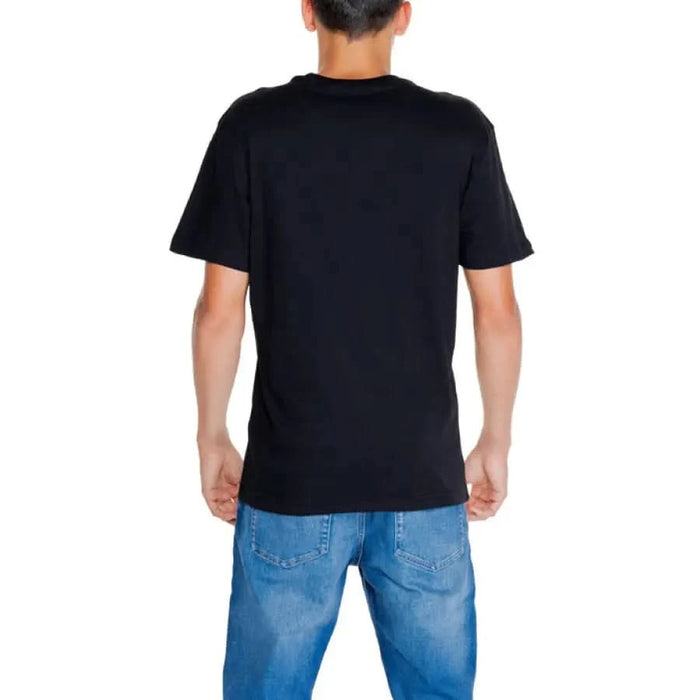 Back view of Black Calvin Klein T-shirt and blue jeans from Calvin Klein Jeans collection