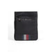 Black Tommy Hilfiger messenger bag featuring a striped accent at the bottom