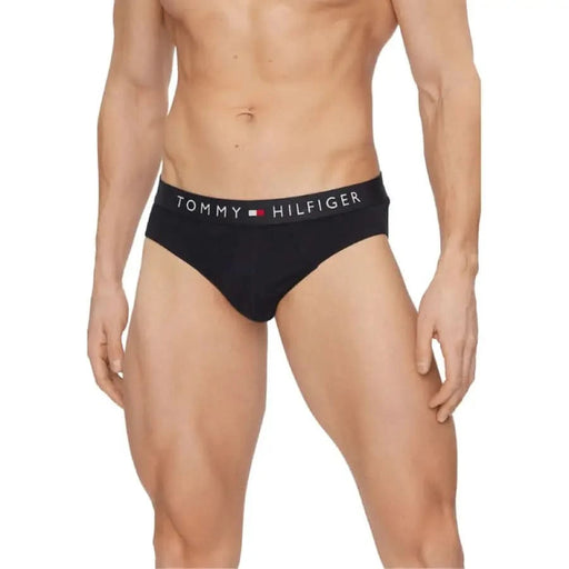 Muscular male torso wearing Black Tommy Hilfiger Men’s Underwear Briefs