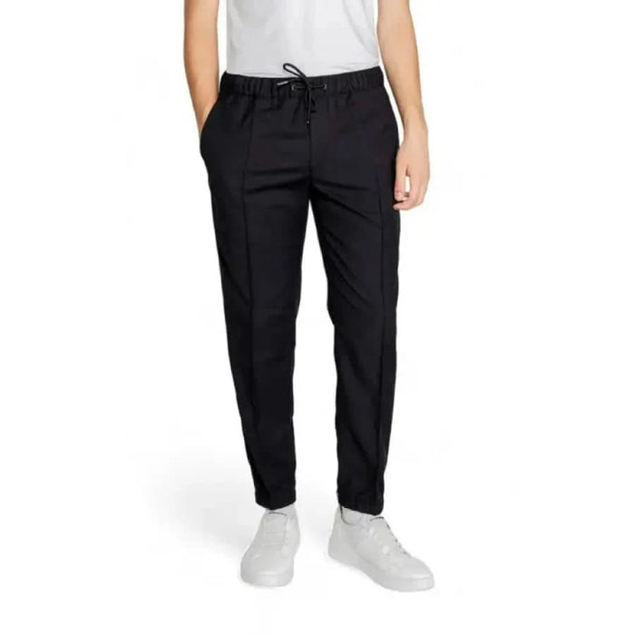 Black drawstring trousers with tapered legs and side pockets from Armani Exchange Men