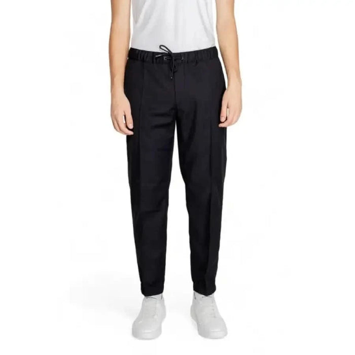 Black drawstring trousers with tapered legs, part of Armani Exchange Men collection