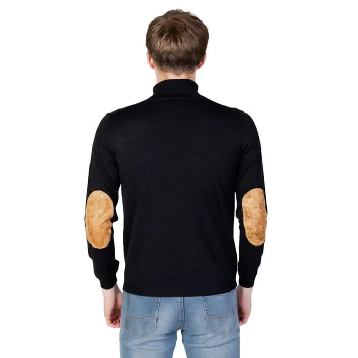 Black turtleneck sweater with tan elbow patches from Alviero Martini Prima Classe Knitwear