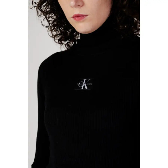 Black turtleneck sweater featuring Calvin Klein logo from Calvin Klein Jeans Women Dress line