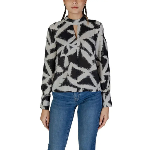 Black and white geometric patterned blouse by Jacqueline De Yong with long sleeves and keyhole neckline