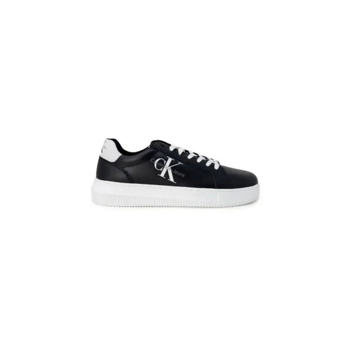 Black and white low-top Calvin Klein Jeans sneakers featuring CK logo on the side