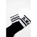 Black and white socks with text on the cuffs from Martens Men Underwear collection