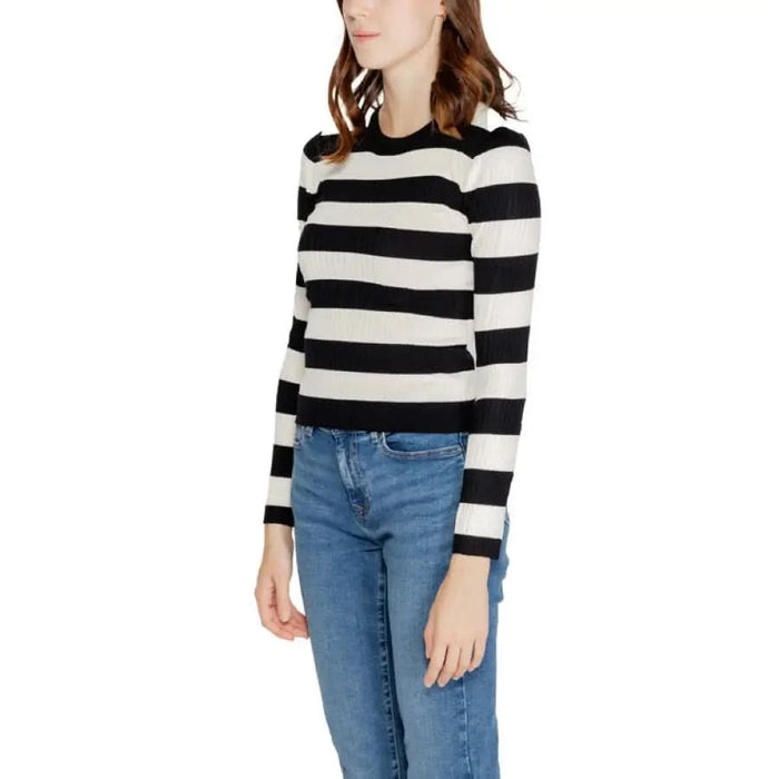 Black and white striped long-sleeved sweater paired with blue jeans from Jacqueline De Yong