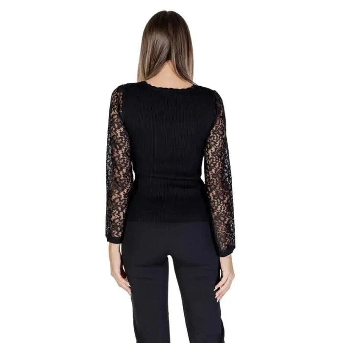 Black wrap-style top with lace sleeves and tie waist from Morgan De Toi Women’s T-Shirt