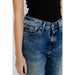 Blue denim jeans by Tommy Hilfiger with a black top at the waistband for women