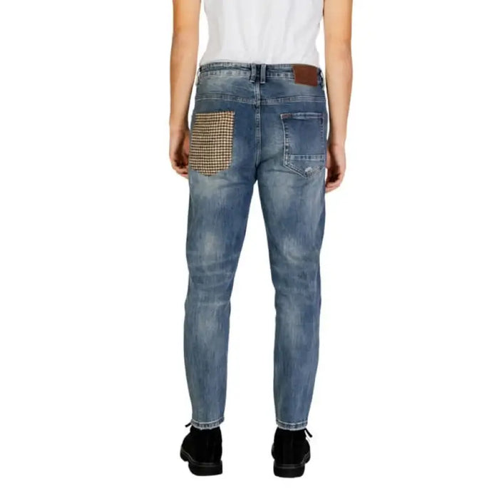 Blue distressed Gianni Lupo men jeans featuring a studded back pocket design