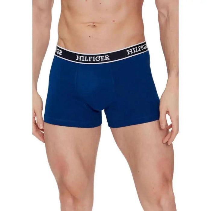 Blue Tommy Hilfiger boxer briefs worn by male model, product: Tommy Hilfiger Men Underwear