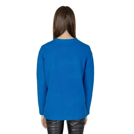 Bright blue long-sleeved Street One sweater on person with long brown hair