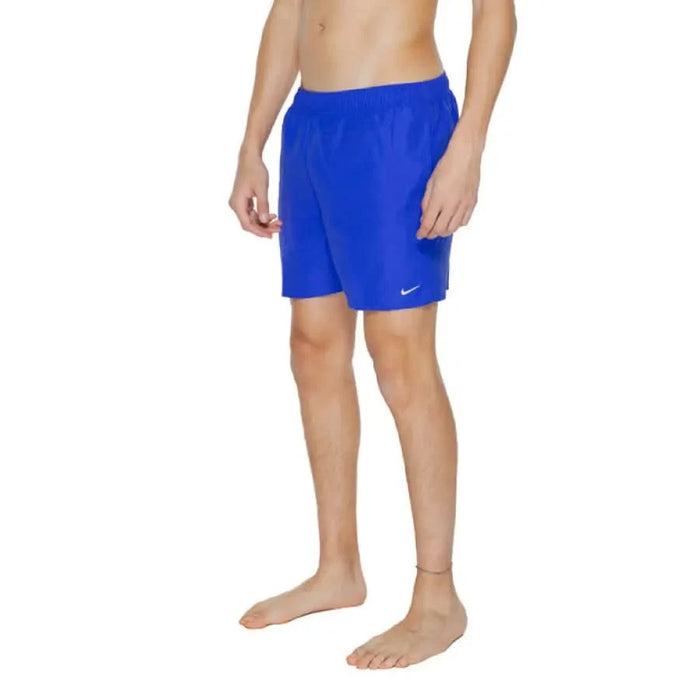 Bright blue Nike swim shorts being modeled, featured in Nike Swim Men Swimwear