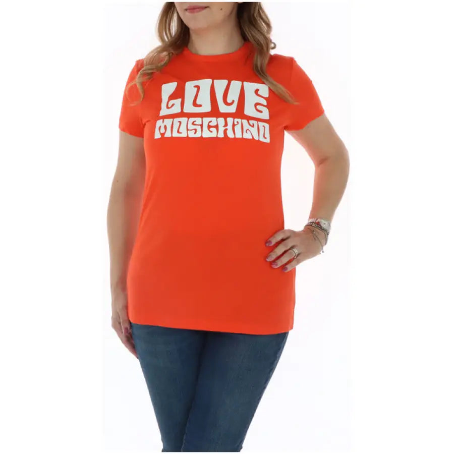 Bright orange Love Moschino t-shirt with ‘LOVE MOSCHINO’ in white letters on the front