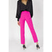 Bright pink straight-leg trousers paired with a black top and high heels from Silence