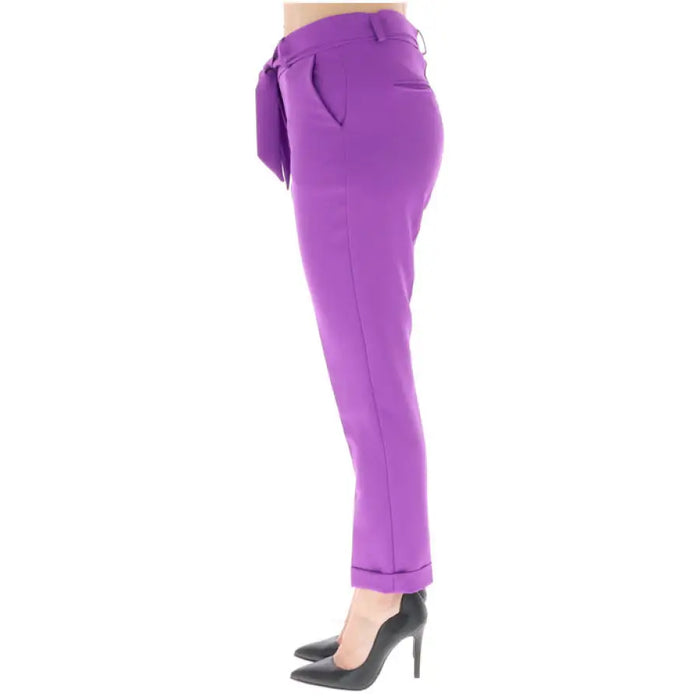 Bright purple cuffed dress pants paired with black high heels from Sol Wears Women