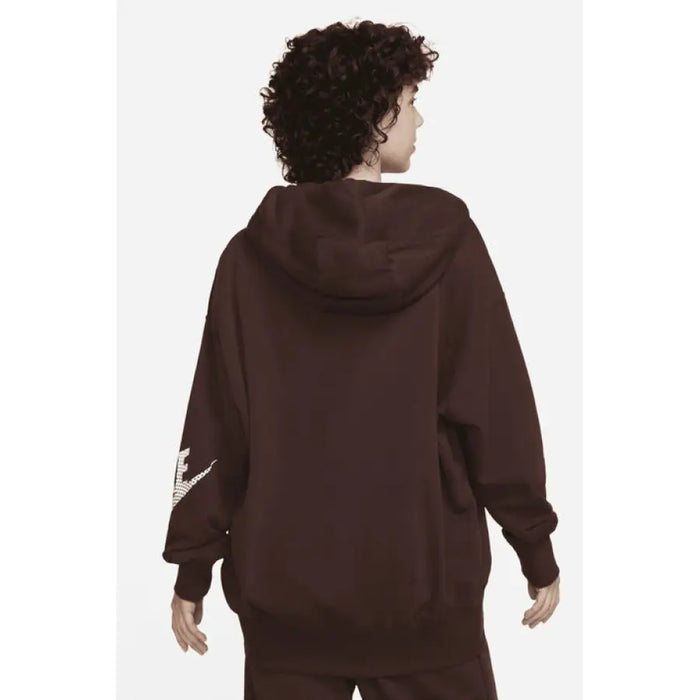 Brown hooded Nike sweatshirt on a person with curly dark hair, viewed from behind