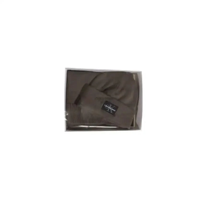 Brown knit winter beanie featuring a label tag from Calvin Klein Jeans Men Cap