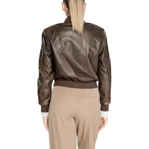 Brown leather bomber jacket featured on a model with long blonde hair from Only