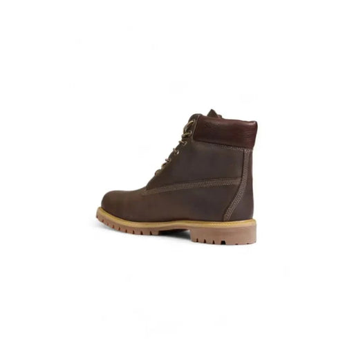 Brown leather Timberland work boot featuring a durable rubber sole and lace-up design