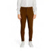 Brown slim-fit Antony Morato men trousers paired with a white shirt and sneakers